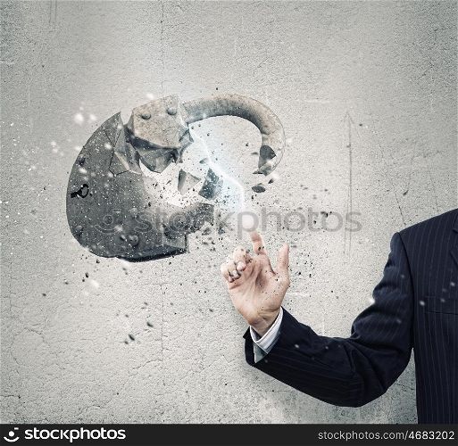 Safety concept. Businessman crushing stone lock with finger touch