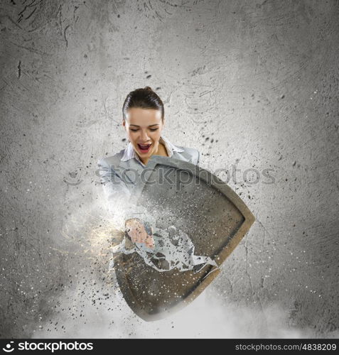 Safety concept. Image of businesswoman crashing with arm shield
