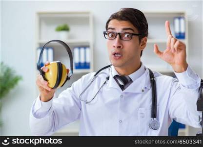 Safety doctor advising about noise cancelling headphones