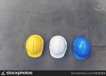 Safety helmet white yellow. Protection head safety equipment in construction site. engineering concept.