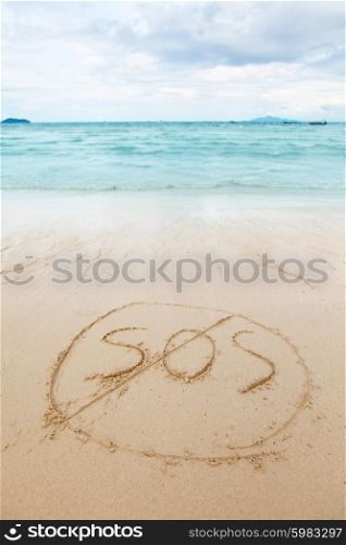 Safety on beach concept. Safety on beach concept - inscription on a beach sand with coming wave