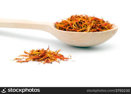 saffron spice in wooden spoon isolation white background