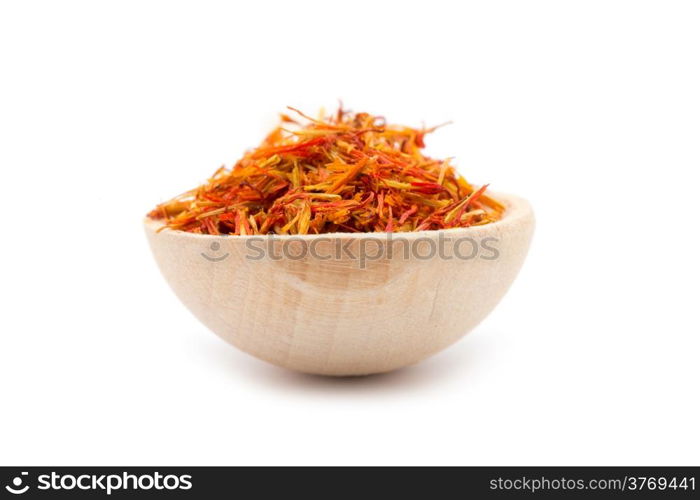 saffron spice in wooden spoon isolation white background