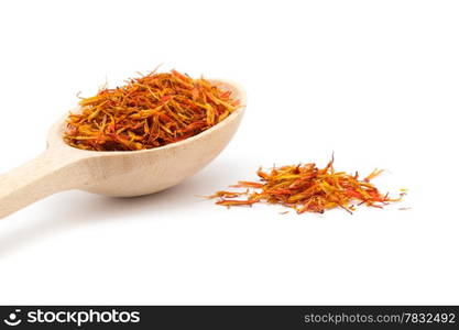 saffron spice in wooden spoon isolation white background