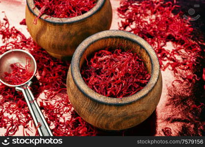 Saffron spice used in food and traditional herbal medicine. Heap of saffron threads