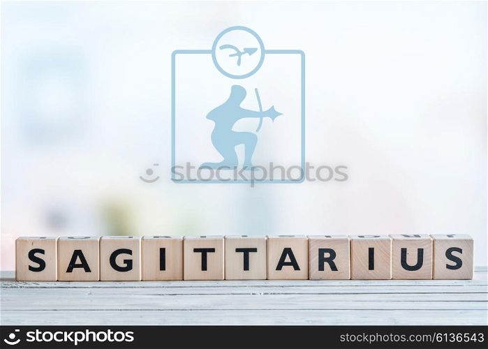 Sagittarius star sign on a wooden table
