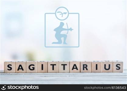 Sagittarius star sign on a wooden table