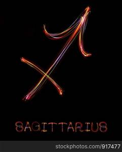 ""Sagittarius",Zodiac sign from led light on black background. "