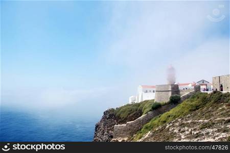 "Sagres Lighthouse at "Cape Saint Vincent"and fog in sky"
