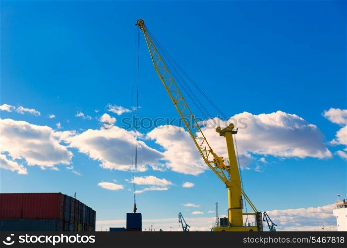 Sagunto port dock yellow crane in Valencia in a sunny day