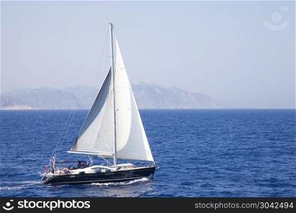 sail boat on the sea. sail boat on the sea in deep blue colour