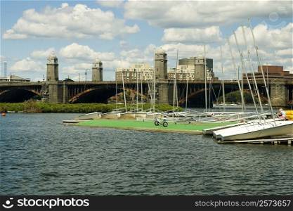 Sail boats anchored in the river near an arch bridge, Boston, Massachusetts, USA