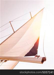 Sail over sunset sky, romantic date in warm summer evening on luxury sailboat, interesting sea adventure, travel and tourism concept