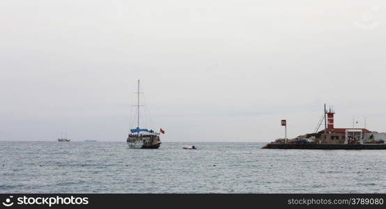 Sail ship moving away from the shore