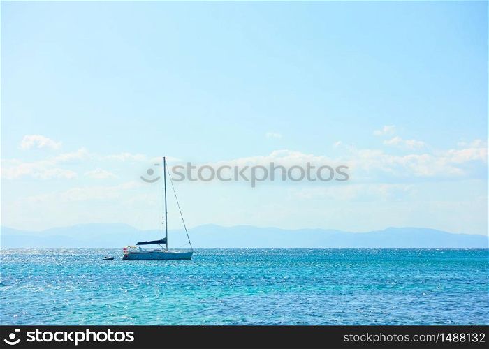 Sail yacht in the sea and blue sky with clouds - seascape