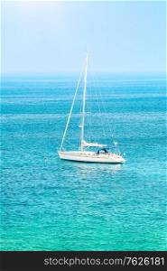 Sailboat among beautiful blue sea in sunny day, summer traveling on the water transport, luxury summertime vacation