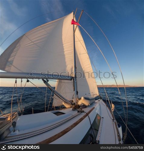 Sailboat crop during the regatta at sunset ocean&#xA;