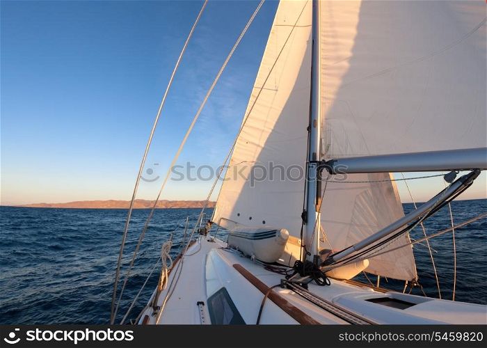 Sailboat crop during the regatta at sunset ocean&#xA;