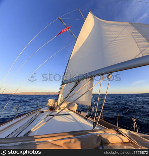 Sailboat crop during the regatta at sunset ocean&#xA;