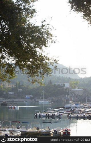 sailboat in the bay of Paleokastritsa at dawn.  Corfu Island in Greece 