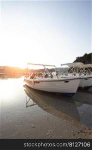 sailboat in the bay of Paleokastritsa at dawn.  Corfu Island in Greece 