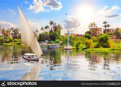Sailboat in the Nile River, Luxor city, scenery of Egypt.. Sailboat in the Nile River, Luxor city, scenery of Egypt