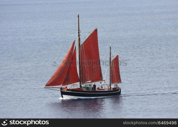 Sailboat on Aegean sea heading to marina on the Skopelos island