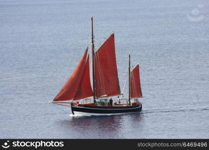 Sailboat on Aegean sea heading to marina on the Skopelos island