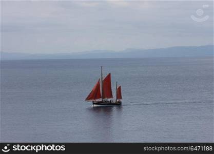 Sailboat on Aegean sea heading to marina on the Skopelos island