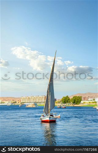 Sailboat riding on Nile river at summer day in Aswan