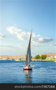 Sailboat riding on Nile river at summer day in Aswan