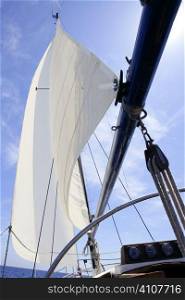 Sailboat sailing blue sea on sunny summer day in Mediterranean