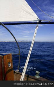 Sailboat sailing blue sea on sunny summer day in Mediterranean