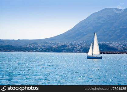 sailboat sailing in Mediterranean sea with Denia Mongo mountain