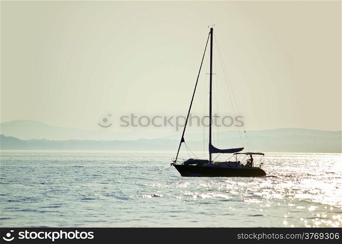 Sailboat silhouette on open water, Dalmatia, Croatia