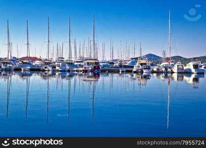 Sailboats and yachts in harbor reflections view, Tribunj, Croatia