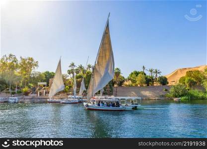 Sailboats by the entrance to Botanical Garden in Aswan, Egypt. Entrance to Botanical Garden