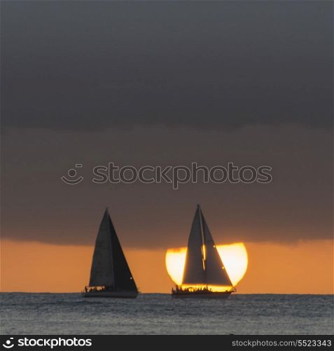 Sailboats in the ocean at sunset, Waikiki, Honolulu, Oahu, Hawaii, USA