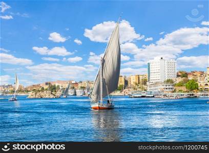 Sailboats on river Nile in Aswan at sunny day. Sunny day in Aswan