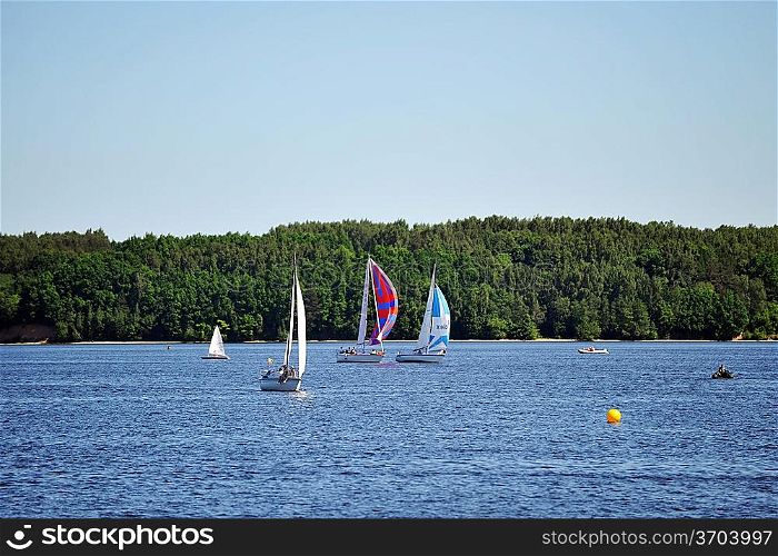 Sailboats on the blue water. summer day at lake