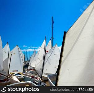 Sailboats school with sail textures in blue sky outdoor at Mediterranean