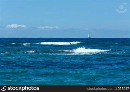 Sailer on horizon and sea summer view from beach (Greece, Lefkada, Ionian Sea).