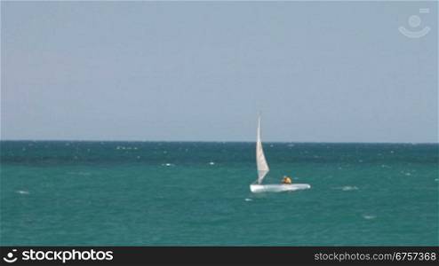 Sailing boat at open sea