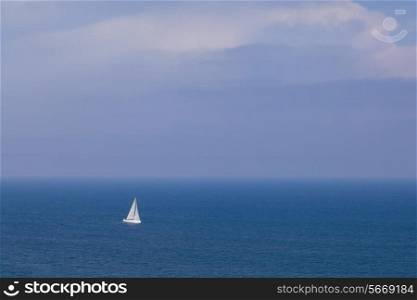 Sailing boat in open blue sea, top view&#xA;