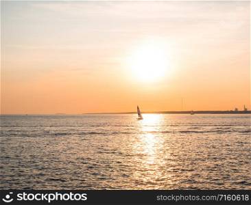 Sailing boat on the sea at sunset.. Sailing boat in the sunset of the Gulf of Finland