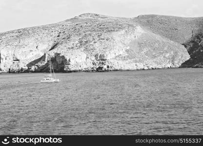 sailing in europe greece santorini island hill and rocks on the summertime beach