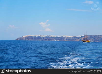 sailing in europe greece santorini island hill and rocks on the summertime beach