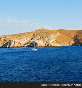 sailing in europe greece santorini island hill and rocks on the summertime beach