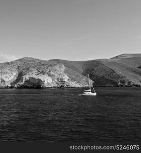 sailing in europe greece santorini island hill and rocks on the summertime beach