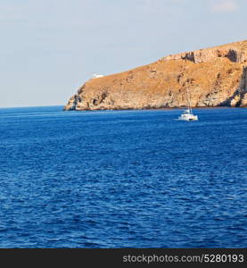 sailing in europe greece santorini island hill and rocks on the summertime beach